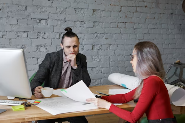 Financial advisor attentively listening to a client's needs.