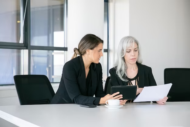 Businesswoman carefully listening during a financial meeting