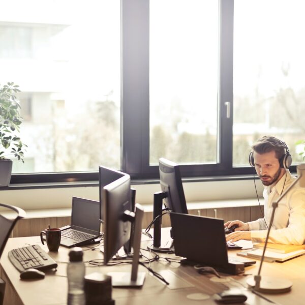 Man working on the computer at financial institution.