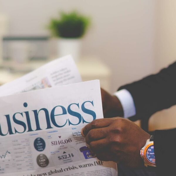 a man reading a business newspaper.